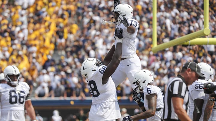 Penn State offensive lineman Anthony Donkoh lifts running back Kaytron Allen after a touchdown against West Virginia in 2024. Penn State offensive lineman Anthony Donkoh lifts running back Kaytron Allen after a touchdown against West Virginia in 2024.