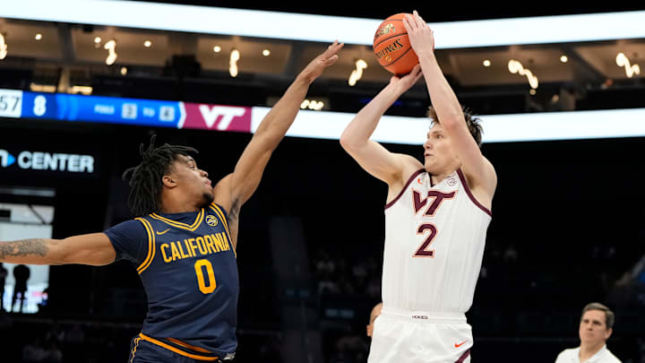 Mar 11, 2025; Charlotte, NC, USA; Virginia Tech Hokies guard Jaden Schutt (2) shoots as California Golden Bears guard Jeremiah Wilkinson (0) defends in the first half at Spectrum Center. Mandatory Credit: Bob Donnan-Imagn Images Mar 11, 2025; Charlotte, NC, USA; Virginia Tech Hokies guard Jaden Schutt (2) shoots as California Golden Bears guard Jeremiah Wilkinson (0) defends in the first half at Spectrum Center. Mandatory Credit: Bob Donnan-Imagn Images