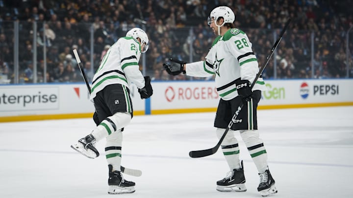 Nov 20, 2025; Vancouver, British Columbia, CAN; Dallas Stars forward Jason Robertson (21) and defenseman Alexander Petrovic (28) celebrate Robertsonu2019s goal against the Vancouver Canucks in the first period at Rogers Arena. Mandatory Credit: Bob Frid-Imagn Images