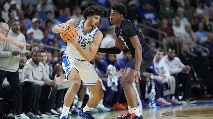 Mar 21, 2026; Greenville, SC, USA; Duke Blue Devils forward Cameron Boozer (12) handles the ball defended by Texas Christian University Horned Frogs forward Xavier Edmonds (24) during a second round game of the men's 2026 NCAA Tournament at Bon Secours Wellness Arena. Mandatory Credit: Jim Dedmon-Imagn Images