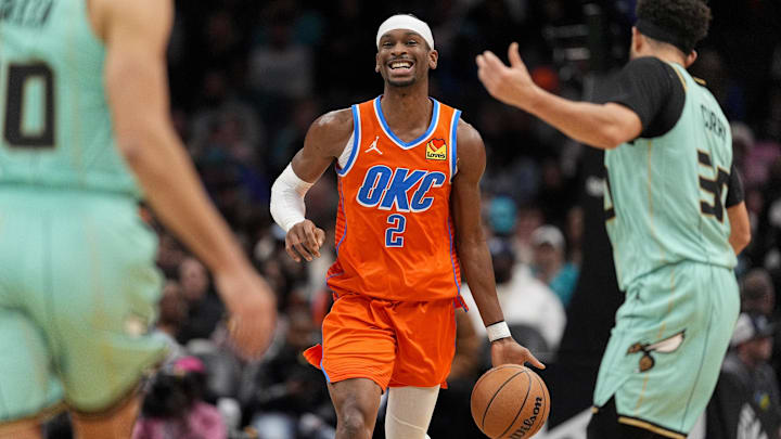 Dec 28, 2024; Charlotte, North Carolina, USA; Oklahoma City Thunder guard Shai Gilgeous-Alexander (2) brings the ball up court against the Charlotte Hornets during the second half at Spectrum Center. Mandatory Credit: Jim Dedmon-Imagn Images