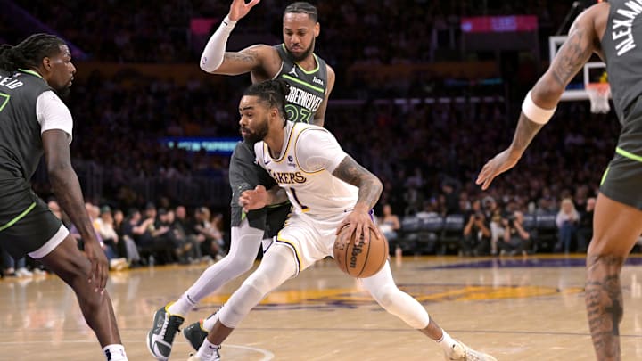 Apr 7, 2024; Los Angeles, California, USA; Los Angeles Lakers guard D'Angelo Russell (1) is defended by Minnesota Timberwolves guard Monte Morris (23) in the first half at Crypto.com Arena. Mandatory Credit: Jayne Kamin-Oncea-USA TODAY Sports Apr 7, 2024; Los Angeles, California, USA; Los Angeles Lakers guard D'Angelo Russell (1) is defended by Minnesota Timberwolves guard Monte Morris (23) in the first half at Crypto.com Arena. Mandatory Credit: Jayne Kamin-Oncea-USA TODAY Sports