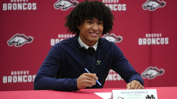 Brophy Prep senior Devin Fitzgerald signs his letter of intent to play football for Notre Dame during early signing day at Brophy Prep High School in Phoenix, Ariz. on Dec. 3, 2025.