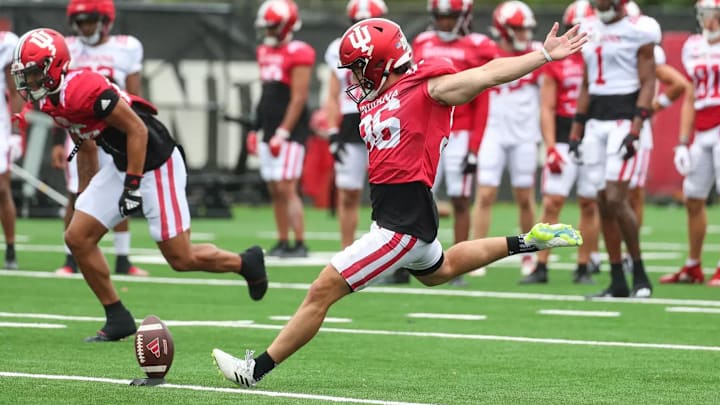 Alejandro Quintero kicks off during practice.