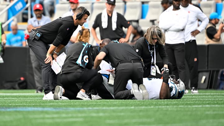 Sep 29, 2024; Charlotte, North Carolina, USA; Carolina Panthers head coach Dave Canales checks on linebacker Shaq Thompson (54) after an injury in the third quarter at Bank of America Stadium. Sep 29, 2024; Charlotte, North Carolina, USA; Carolina Panthers head coach Dave Canales checks on linebacker Shaq Thompson (54) after an injury in the third quarter at Bank of America Stadium.
