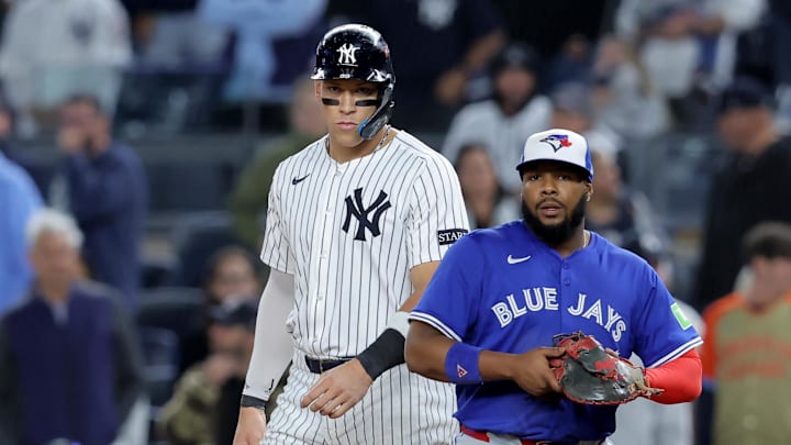 Oct 8, 2025; Bronx, New York, USA; New York Yankees right fielder Aaron Judge (99) leads off first base against Toronto Blue Jays first baseman Vladimir Guerrero Jr. (27) during the ninth inning of game four of the ALDS round of the 2025 MLB playoffs at Yankee Stadium. Mandatory Credit: Brad Penner-Imagn Images Oct 8, 2025; Bronx, New York, USA; New York Yankees right fielder Aaron Judge (99) leads off first base against Toronto Blue Jays first baseman Vladimir Guerrero Jr. (27) during the ninth inning of game four of the ALDS round of the 2025 MLB playoffs at Yankee Stadium. Mandatory Credit: Brad Penner-Imagn Images