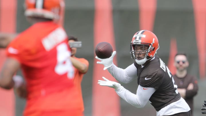 Browns quarterback Deshaun Watson throws a touchdown pass to Amari Cooper during practice, Wednesday, May 25, 2022, in Berea.