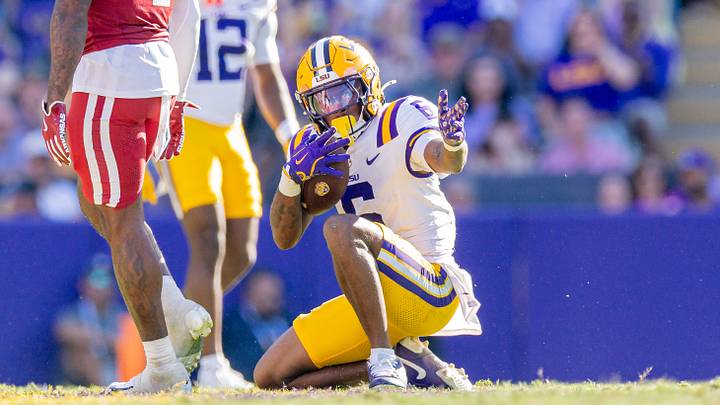 Nov 15, 2025; Baton Rouge, Louisiana, USA; LSU Tigers wide receiver Barion Brown (6) reacts to catching pass for a first down against Arkansas Razorbacks cornerback Jordan Young (4) during the second half at Tiger Stadium. Mandatory Credit: Stephen Lew-Imagn Images Nov 15, 2025; Baton Rouge, Louisiana, USA; LSU Tigers wide receiver Barion Brown (6) reacts to catching pass for a first down against Arkansas Razorbacks cornerback Jordan Young (4) during the second half at Tiger Stadium. Mandatory Credit: Stephen Lew-Imagn Images