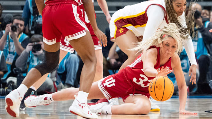 Indiana Hoosiers guard Sydney Parrish (33) fights Friday, March 7, 2025, for a loose ball with USC Trojans guard Kennedy Smith (11) during the Big Ten women's tournament at Gainbridge Fieldhouse in Indianapolis. Indiana Hoosiers guard Sydney Parrish (33) fights Friday, March 7, 2025, for a loose ball with USC Trojans guard Kennedy Smith (11) during the Big Ten women's tournament at Gainbridge Fieldhouse in Indianapolis.
