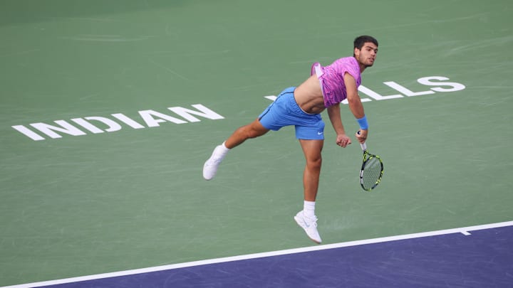 Carlos Alcaraz serves during the BNP Paribas Open on March 16, 2024 at Indian Wells Tennis Garden in Indian Wells, CA. Carlos Alcaraz serves during the BNP Paribas Open on March 16, 2024 at Indian Wells Tennis Garden in Indian Wells, CA.