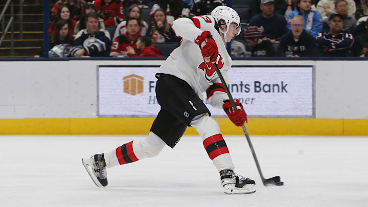 Mar 17, 2025; Columbus, Ohio, USA; New Jersey Devils defenseman Luke Hughes (43) wrists a shot on goal against the Columbus Blue Jackets during the second period at Nationwide Arena. Mandatory Credit: Russell LaBounty-Imagn Images