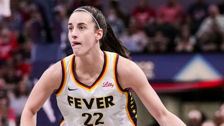 Indiana Fever guard Caitlin Clark (22) dribbles the ball up the court. Indiana Fever guard Caitlin Clark (22) dribbles the ball up the court.