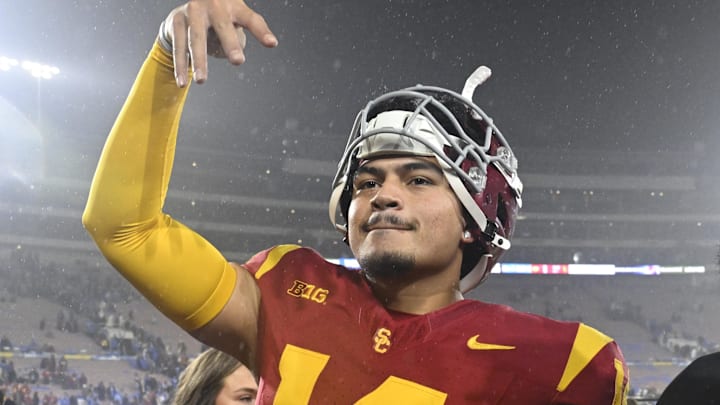 Nov 23, 2024; Pasadena, California, USA;  USC Trojans quarterback Jayden Maiava (14) celebrates the win over UCLA at Rose Bowl. Mandatory Credit: Robert Hanashiro-Imagn Images