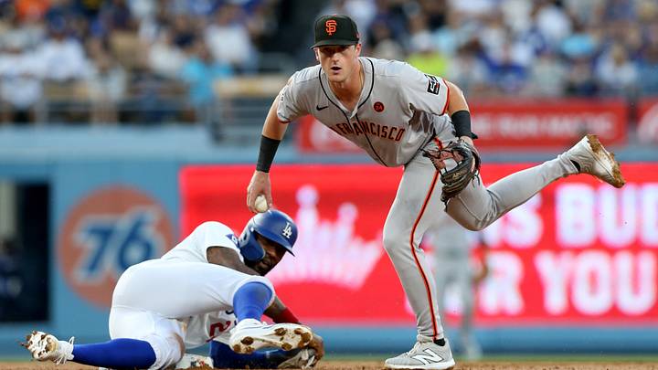 Jul 23, 2024; Los Angeles, California, USA; San Francisco Giants outfielder Tyler Fitzgerald (49) looks to first after forcing out Los Angeles Dodgers outfielder Jason Heyward (23) during the second inning at Dodger Stadium. Mandatory Credit: Jason Parkhurst-Imagn Images Jul 23, 2024; Los Angeles, California, USA; San Francisco Giants outfielder Tyler Fitzgerald (49) looks to first after forcing out Los Angeles Dodgers outfielder Jason Heyward (23) during the second inning at Dodger Stadium. Mandatory Credit: Jason Parkhurst-Imagn Images