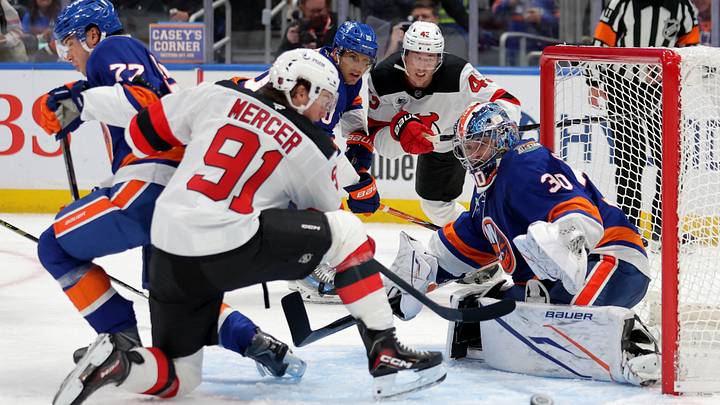 Oct 3, 2026; Elmont, New York, USA; New York Islanders goaltender Ilya Sorokin (30) makes a save against New Jersey Devils center Dawson Mercer (91) in front of Islanders defenseman Tony DeAngelo (77) and center Brayden Schenn (10) and Devils defenseman Luke Hughes (43) during the second period at UBS Arena. Mandatory Credit: Brad Penner-Imagn Images