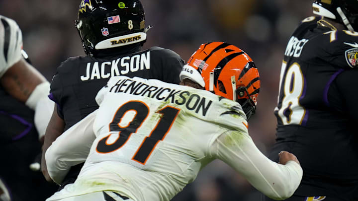 Cincinnati Bengals defensive end Trey Hendrickson (91) sacks Baltimore Ravens quarterback Lamar Jackson (8) in the first quarter of the NFL Week 11 game between the Baltimore Ravens and the Cincinnati Bengals at M&T Bank Stadium in Baltimore on Thursday, Nov. 16, 2023.