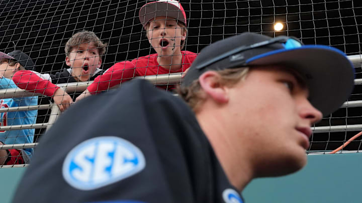 Some young Georgia fans bark at Kentucky players as they enter the dugout during a NCAA baseball game against Kentucky on March 14, 2025.