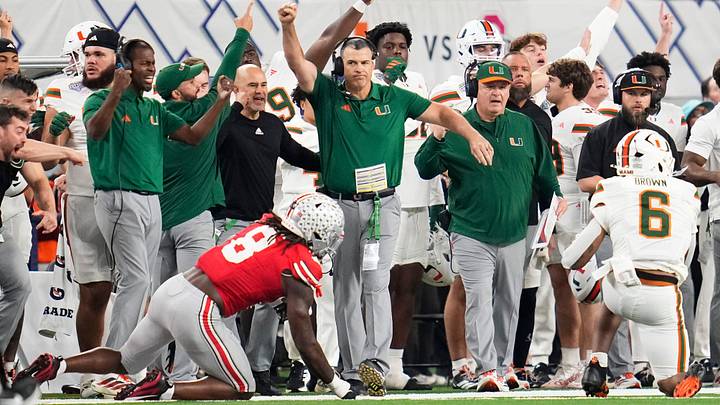 Miami Hurricanes head coach Mario Cristobal celebrates during the Cotton Bowl at AT&T Stadium in Arlington, Texas for the College Football Playoff quarterfinal game against the Ohio State Buckeyes on Dec. 31, 2025. Ohio State lost 24-14. Miami Hurricanes head coach Mario Cristobal celebrates during the Cotton Bowl at AT&T Stadium in Arlington, Texas for the College Football Playoff quarterfinal game against the Ohio State Buckeyes on Dec. 31, 2025. Ohio State lost 24-14.