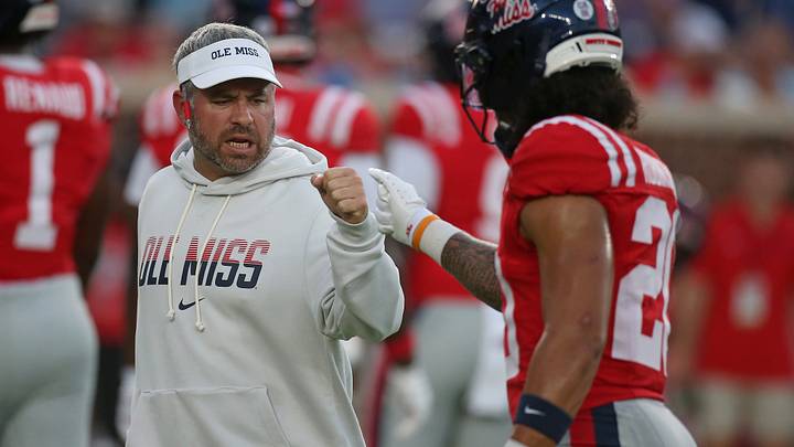 Sep 12, 2026; Oxford, Mississippi, USA; Mississippi Rebels Head Coach Pete Golding reacts with Mississippi Rebels safety Anthony Robinson III (20) during warm ups prior to the game against the Charlotte 49ers at Vaught-Hemingway Stadium. Mandatory Credit: Petre Thomas-Imagn Images Sep 12, 2026; Oxford, Mississippi, USA; Mississippi Rebels Head Coach Pete Golding reacts with Mississippi Rebels safety Anthony Robinson III (20) during warm ups prior to the game against the Charlotte 49ers at Vaught-Hemingway Stadium. Mandatory Credit: Petre Thomas-Imagn Images