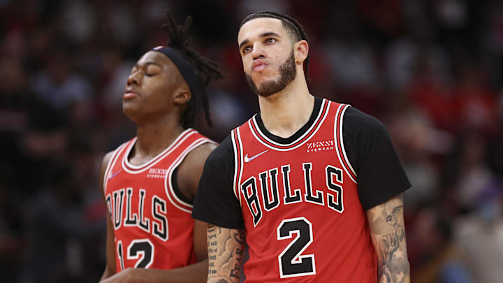 Nov 24, 2021; Houston, Texas, USA; Chicago Bulls guard Lonzo Ball (2) and guard Ayo Dosunmu (12) react during the fourth quarter against the Houston Rockets at Toyota Center. Mandatory Credit: Troy Taormina-Imagn Images