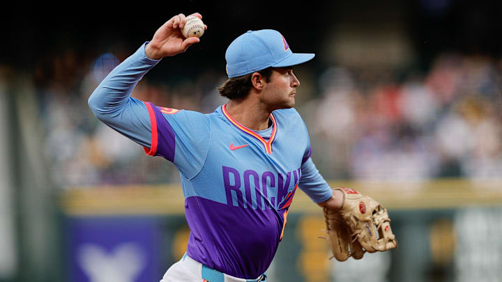 Sep 19, 2025; Denver, Colorado, USA; Colorado Rockies third baseman Kyle Karros (12) throws to first for an out in the second inning against the Los Angeles Angels at Coors Field. Mandatory Credit: Isaiah J. Downing-Imagn Images