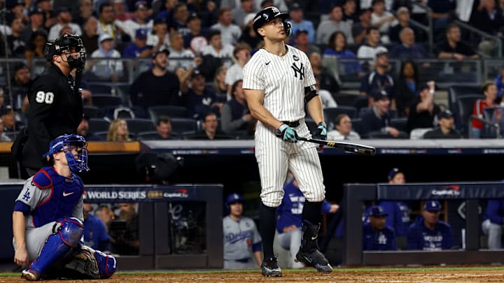 Oct 30, 2024; New York, New York, USA; New York Yankees designated hitter Giancarlo Stanton (27) reacts after hitting a home run during the third inning against the Los Angeles Dodgers in game five of the 2024 MLB World Series at Yankee Stadium. Mandatory Credit: Vincent Carchietta-Imagn Images