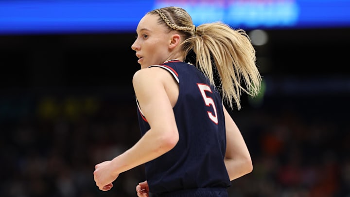 Apr 4, 2025; Tampa, FL, USA; Connecticut Huskies guard Paige Bueckers (5) reacts during the third quarter in a semifinal of the women's 2025 NCAA tournament against the UCLA Bruins at Amalie Arena. Mandatory Credit: Nathan Ray Seebeck-Imagn Images Apr 4, 2025; Tampa, FL, USA; Connecticut Huskies guard Paige Bueckers (5) reacts during the third quarter in a semifinal of the women's 2025 NCAA tournament against the UCLA Bruins at Amalie Arena. Mandatory Credit: Nathan Ray Seebeck-Imagn Images