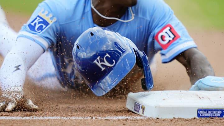Aug 13, 2025; Kansas City, Missouri, USA; Kansas City Royals second baseman Tyler Tolbert (2) loses his helmet as he steals third base during the eighth inning against the Washington Nationals at Kauffman Stadium. Mandatory Credit: Jay Biggerstaff-Imagn Images Aug 13, 2025; Kansas City, Missouri, USA; Kansas City Royals second baseman Tyler Tolbert (2) loses his helmet as he steals third base during the eighth inning against the Washington Nationals at Kauffman Stadium. Mandatory Credit: Jay Biggerstaff-Imagn Images