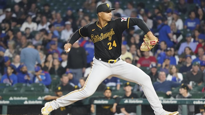 Sep 21, 2023; Chicago, Illinois, USA; Pittsburgh Pirates starting pitcher Johan Oviedo (24) throws the ball against the Chicago Cubs during the first inning at Wrigley Field. Mandatory Credit: David Banks-Imagn Images