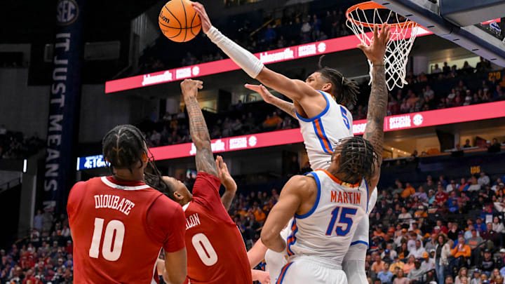 Mar 15, 2025; Nashville, TN, USA; Florida Gators guard Will Richard (5) blocks the shot of Alabama Crimson Tide guard Labaron Philon (0) during the second half at Bridgestone Arena. Mandatory Credit: Steve Roberts-Imagn Images