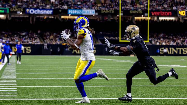 Dec 1, 2024; New Orleans, Louisiana, USA; Los Angeles Rams wide receiver Demarcus Robinson (15) catches a touchdown pass from quarterback Matthew Stafford (9) against the New Orleans Saints during the second half at Caesars Superdome. Mandatory Credit: Stephen Lew-Imagn Images Dec 1, 2024; New Orleans, Louisiana, USA; Los Angeles Rams wide receiver Demarcus Robinson (15) catches a touchdown pass from quarterback Matthew Stafford (9) against the New Orleans Saints during the second half at Caesars Superdome. Mandatory Credit: Stephen Lew-Imagn Images