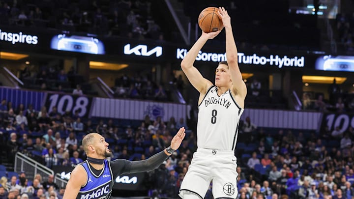 Nov 14, 2025; Orlando, Florida, USA; Brooklyn Nets guard Egor Demin (8) shoots against Orlando Magic guard Jalen Suggs (4) during the first quarter at Kia Center. Mandatory Credit: Mike Watters-Imagn Images