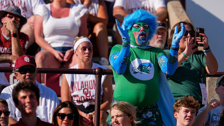 A Tulane fan cheers during a college football game between the University of Oklahoma Sooners (OU) and the Tulane Green Wave at Gaylord Family - Oklahoma Memorial Stadium in Norman, Okla., Saturday, Sept. 14, 2024. A Tulane fan cheers during a college football game between the University of Oklahoma Sooners (OU) and the Tulane Green Wave at Gaylord Family - Oklahoma Memorial Stadium in Norman, Okla., Saturday, Sept. 14, 2024.