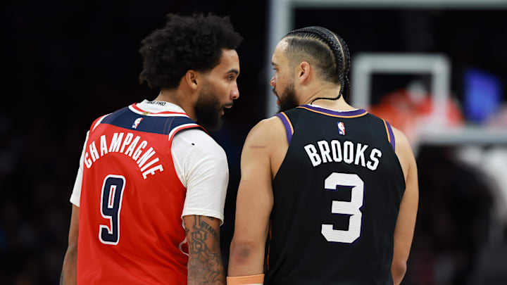 Jan 11, 2026; Phoenix, Arizona, USA; Phoenix Suns forward Dillon Brooks (3) argues with Washington Wizards forward Justin Champagnie (9) in the second half at Mortgage Matchup Center. Mandatory Credit: Mark J. Rebilas-Imagn Images
