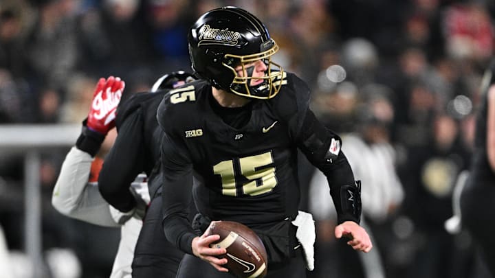Purdue Boilermakers quarterback Ryan Browne (15) drops back to pass.