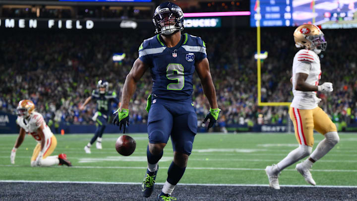 Jan 17, 2026; Seattle, WA, USA; Seattle Seahawks running back Kenneth Walker III (9) scores a touchdown against the San Francisco 49ers during the first half in an NFC Divisional Round game at Lumen Field. 