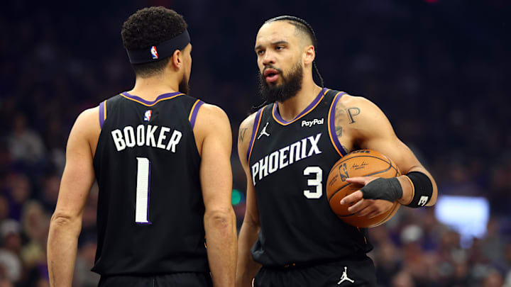 Apr 14, 2026; Phoenix, Arizona, USA; Phoenix Suns forward Dillon Brooks (3) with guard Devin Booker (1) against the Portland Trail Blazers in the first half during the play-in rounds of the 2026 NBA Playoffs at Mortgage Matchup Center. Mandatory Credit: Mark J. Rebilas-Imagn Images
