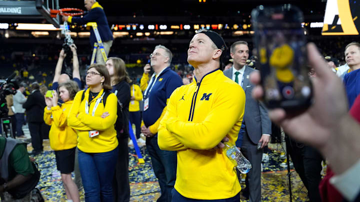 Michigan head coach Dusty May watches the Jumbotron during the NCAA national championship trophy after the team beat Connecticut at Lucas Oil Stadium in Indianapolis on Monday, April 6, 2026.
