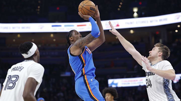 Dec 22, 2025; Oklahoma City, Oklahoma, USA; Oklahoma City Thunder guard Jalen Williams (8) shoots over Memphis Grizzlies guard Cam Spencer (24) during the second half at Paycom Center. Mandatory Credit: Alonzo Adams-Imagn Images