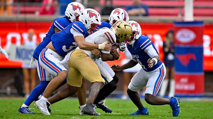 Oct 3, 2026; Dallas, Texas, USA; Boston College Eagles wide receiver Javarius Green (4) is tackled by the SMU Mustangs defense during the second half at Gerald J. Ford Stadium. Mandatory Credit: Jerome Miron-Imagn Images Oct 3, 2026; Dallas, Texas, USA; Boston College Eagles wide receiver Javarius Green (4) is tackled by the SMU Mustangs defense during the second half at Gerald J. Ford Stadium. Mandatory Credit: Jerome Miron-Imagn Images