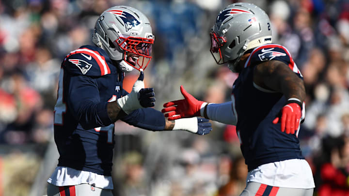 Nov 2, 2025; Foxborough, Massachusetts, USA; New England Patriots linebacker K'Lavon Chaisson (44) reacts with linebacker Harold Landry III (2) after a sack against the Atlanta Falcons during the first quarter at Gillette Stadium.