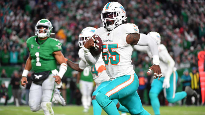 Miami Dolphins linebacker Jerome Baker (55) returns an interception for a touchdown  during the third quarter against the Philadelphia Eagles at Lincoln Financial Field in 2023.