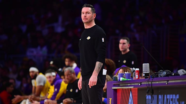 Dec 31, 2024; Los Angeles, California, USA; Los Angeles Lakers head coach JJ Redick watches game action against the Cleveland Cavaliers during the first half at Crypto.com Arena. Mandatory Credit: Gary A. Vasquez-Imagn Images
