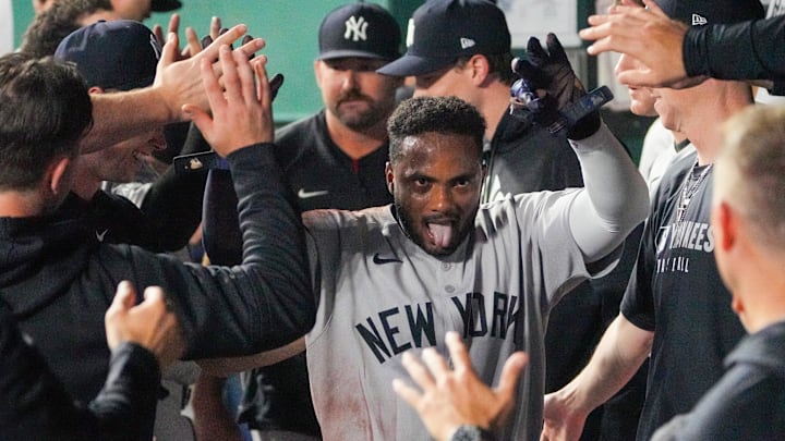 Kansas City, Missouri, USA; New York Yankees second baseman Pablo Reyes (19) is congratulated in the dugout against the Kansas City Royals after scoring in the eighth inning at Kauffman Stadium. Mandatory Credit: Denny Medley-Imagn Images