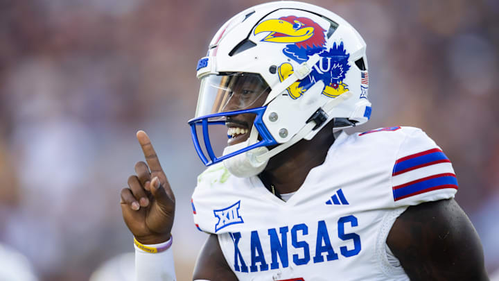 Oct 5, 2024; Tempe, Arizona, USA; Kansas Jayhawks quarterback Jalon Daniels (6) celebrates after running for a touchdown against the Arizona State Sun Devils in the first half at Mountain America Stadium. Mandatory Credit: Mark J. Rebilas-Imagn Images