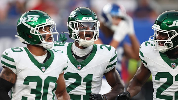 Aug 16, 2025; East Rutherford, New Jersey, USA; New York Jets cornerback Brandon Stephens (21) celebrates a defensive stop with safety Tony Adams (22) and cornerback Michael Carter II (30) during the first half against the New York Giants at MetLife Stadium. Mandatory Credit: Vincent Carchietta-Imagn Images