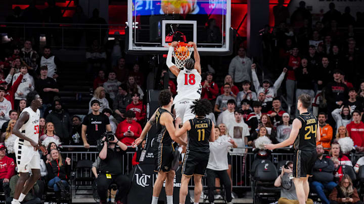 Feb 8, 2026; Cincinnati, Ohio, USA;  Cincinnati Bearcats forward Baba Miller (18) dunks the ball against the UCF Knights in the second half at Fifth Third Arena. Mandatory Credit: Aaron Doster-Imagn Images