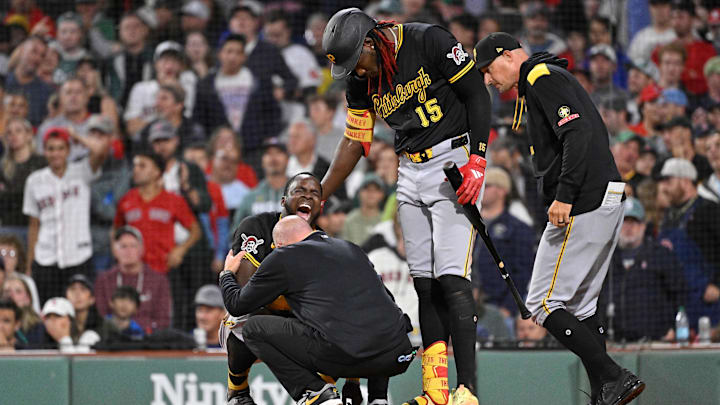Aug 29, 2025; Boston, Massachusetts, USA; Pittsburgh Pirates second baseman Ronny Simon (63) is checked by medical staff after sliding into home plate against the Boston Red Sox during the eighth inning at Fenway Park. Mandatory Credit: Eric Canha-Imagn Images Aug 29, 2025; Boston, Massachusetts, USA; Pittsburgh Pirates second baseman Ronny Simon (63) is checked by medical staff after sliding into home plate against the Boston Red Sox during the eighth inning at Fenway Park. Mandatory Credit: Eric Canha-Imagn Images