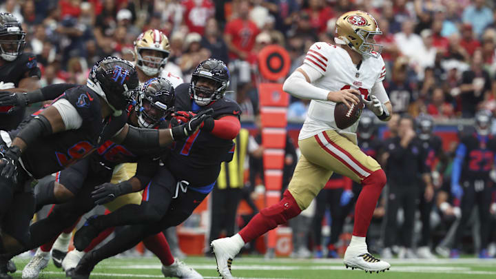 Oct 26, 2025; Houston, Texas, USA; San Francisco 49ers quarterback Mac Jones (10) runs with the ball during the third quarter against the Houston Texans at NRG Stadium. Mandatory Credit: Troy Taormina-Imagn Images