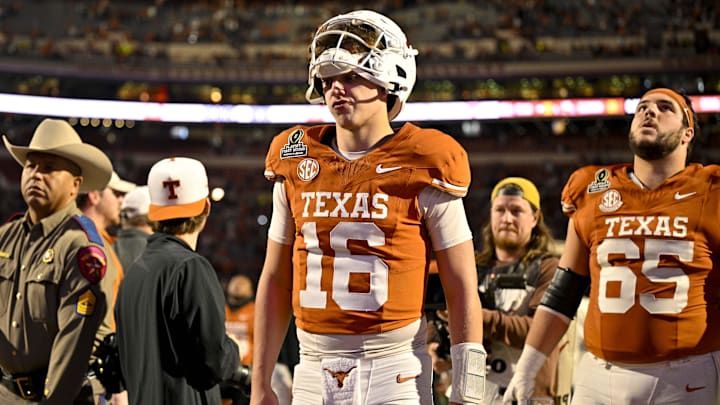 Dec 21, 2024; Austin, Texas, USA; Texas Longhorns quarterback Arch Manning (16) walks off the field after UT defeats the Clemson Tigers in the CFP National Playoff first round game at Darrell K Royal-Texas Memorial Stadium. Mandatory Credit: Jerome Miron-Imagn Images
